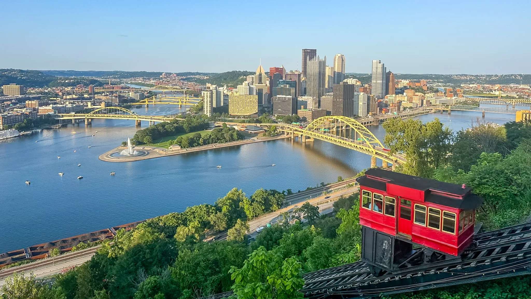 Pittsburgh skyline, the Point and the Fort Pitt Bridge in summer, with a Duquesne Incline car